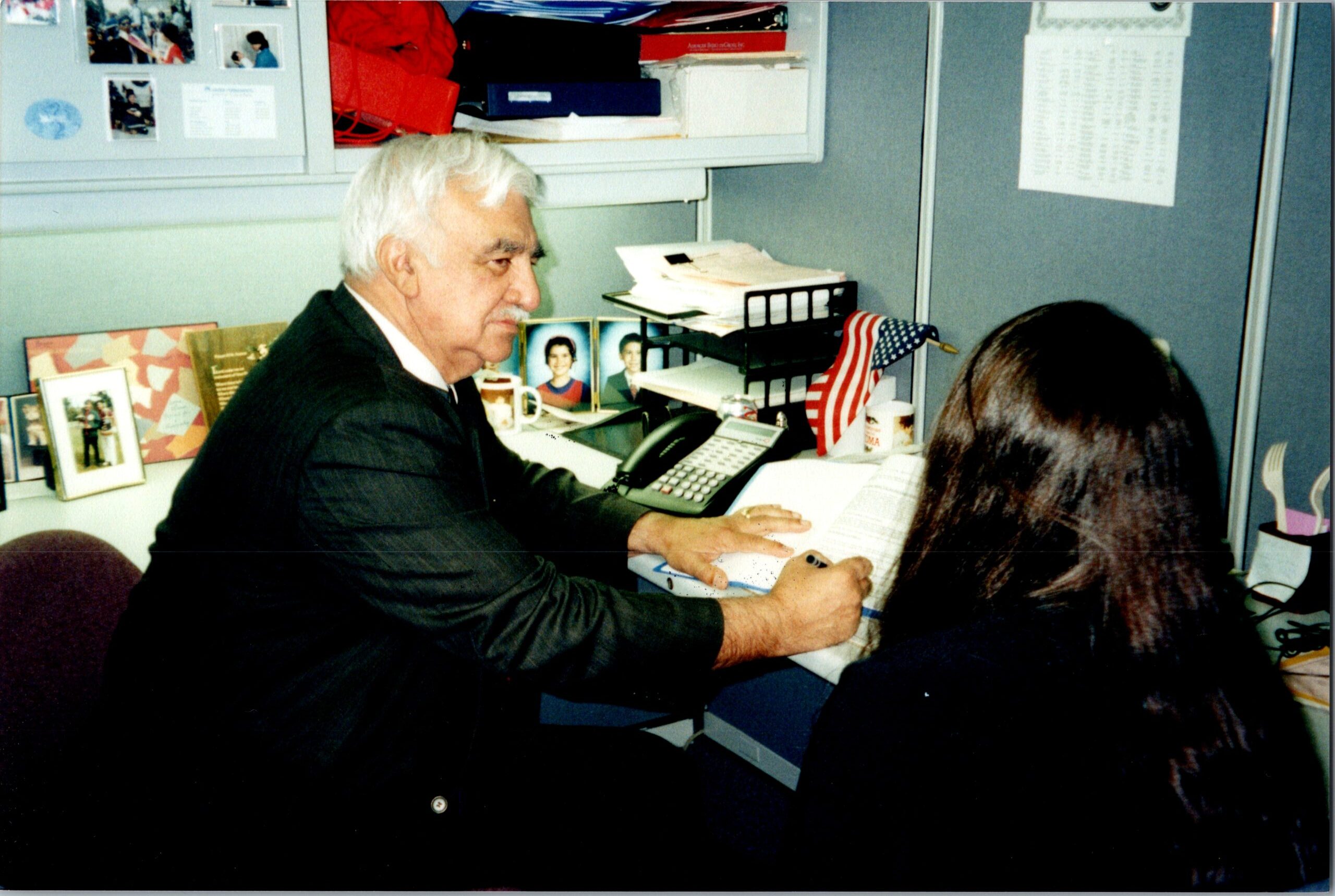 Armando teaching a female employee english