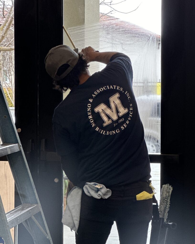 moreno employee washing a window