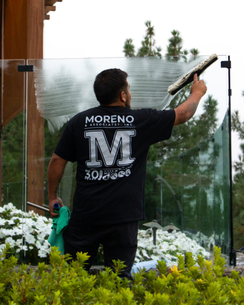 moreno employee washing a window