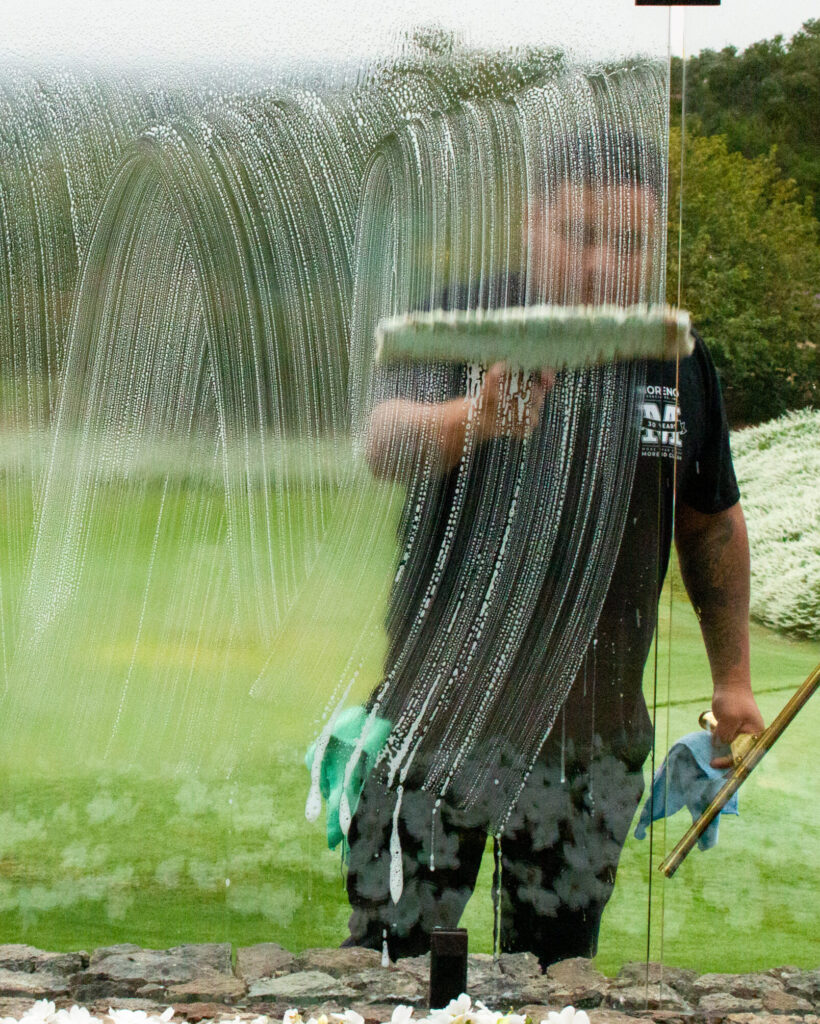 moreno employee washing a window