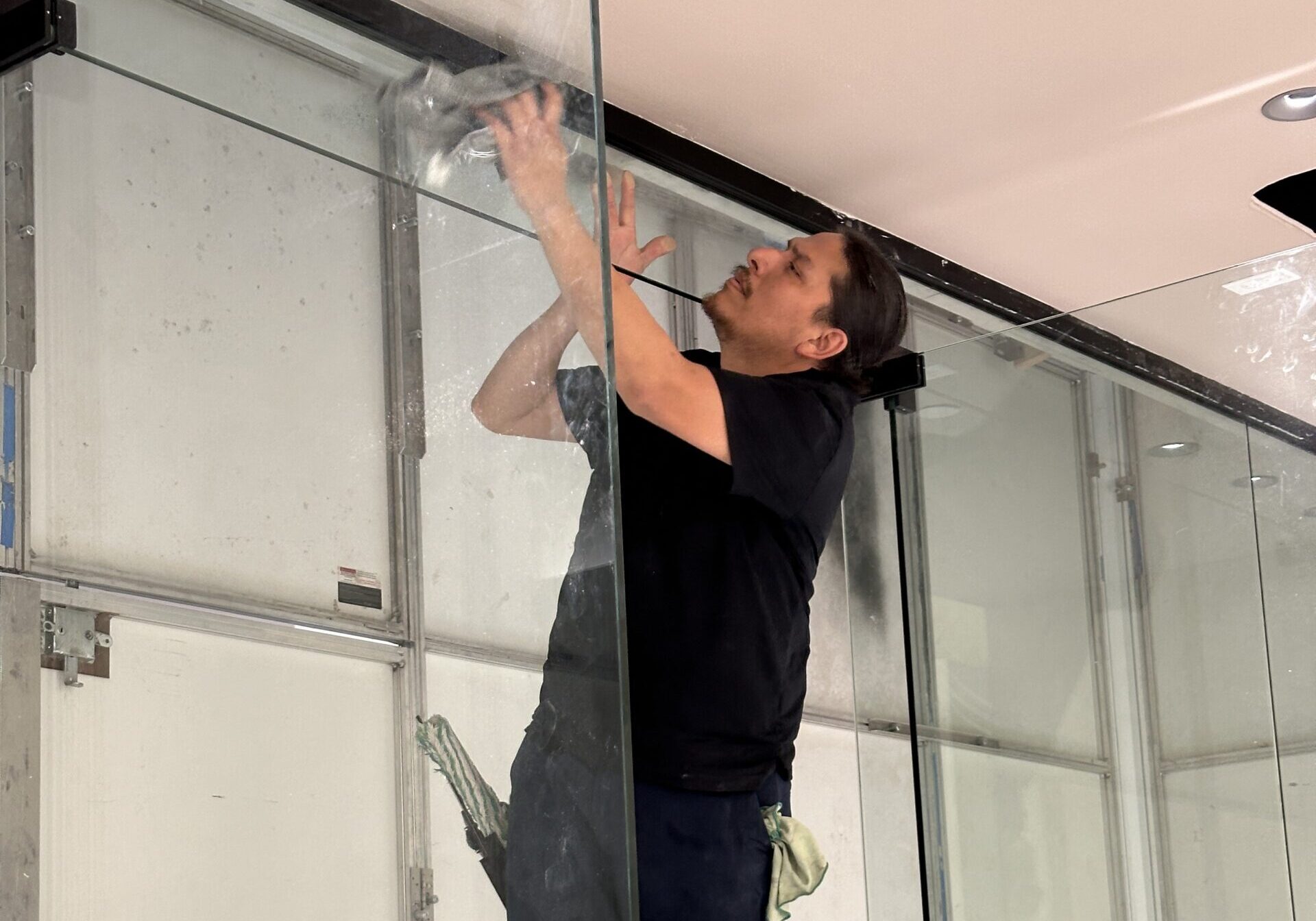 moreno employee cleaning a door frame